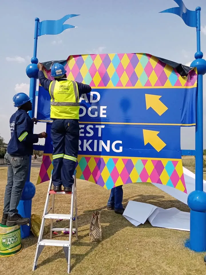 MBC Signs team installing custom directional signage at Carnival City